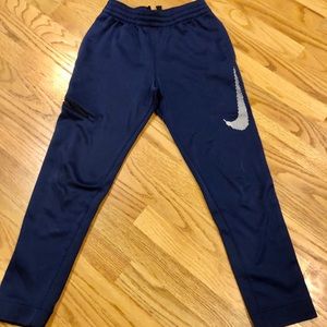 Nike blue dri-fit joggers with Nike symbol
